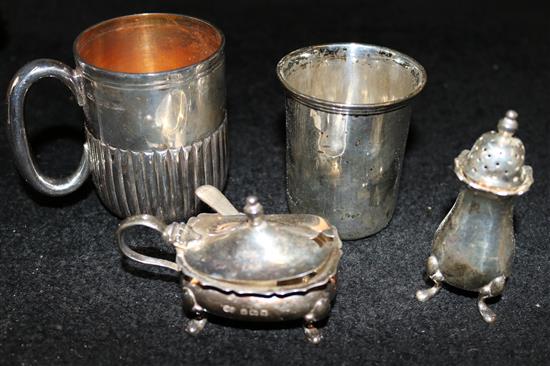 A late Victorian silver christening mug, and engraved silver beaker and a silver salt and mustard pot